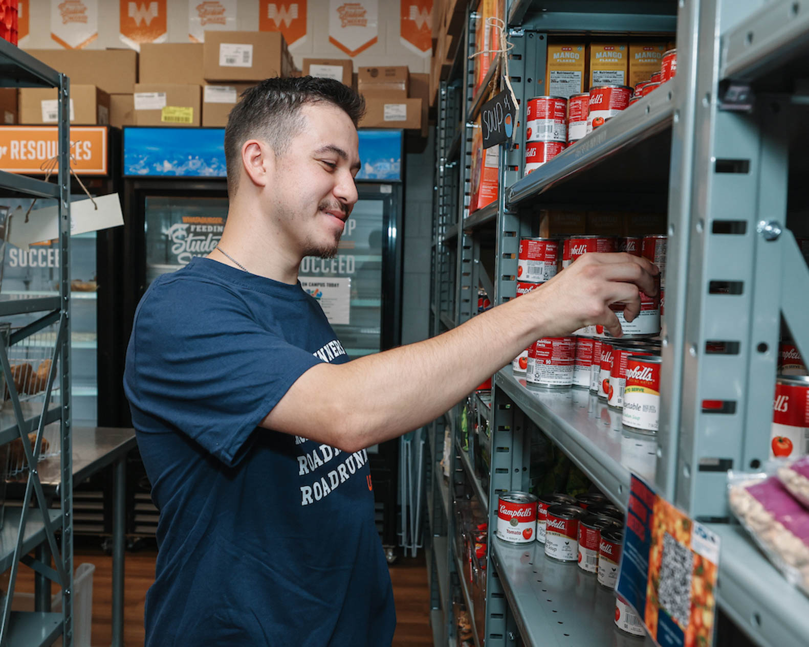 Stuff the Pantry guy stocking shelf